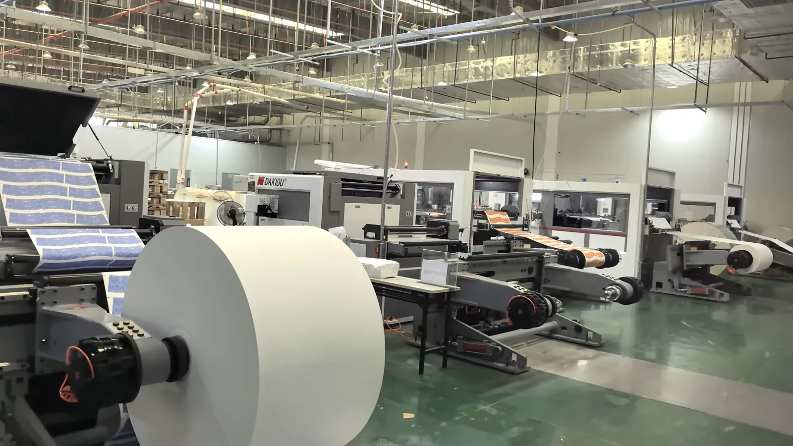 Printed food paper web moving through LANGMAI production equipment